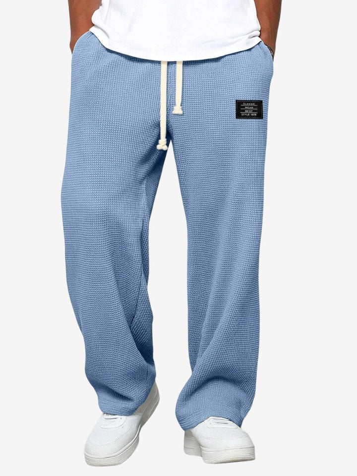 Men's relaxed straight-leg everyday trousers in a versatile hue, perfect for casual or smart-casual wear.