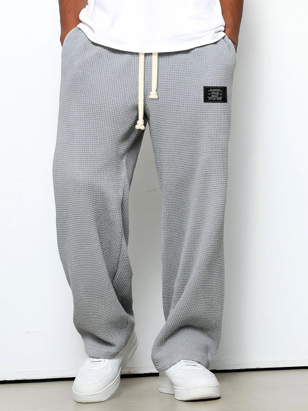Front view of men's relaxed straight-leg casual pants, featuring a comfortable design and clean lines.