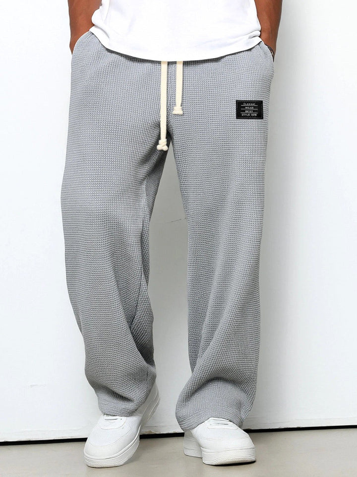 Front view of men's relaxed straight-leg casual pants, featuring a comfortable design and clean lines.