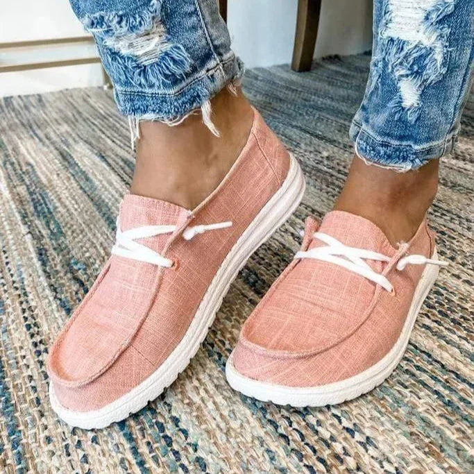 Women's bunion relief slip-on flats on foot, showcasing wide fit & ultimate comfort.