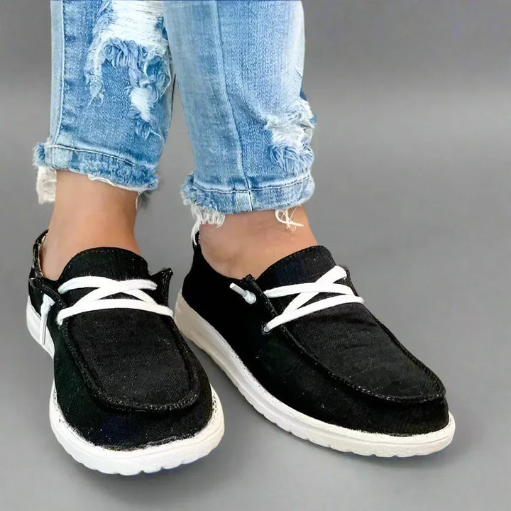 Side view of women's comfort bunion relief slip-on flats, orthotic friendly design.