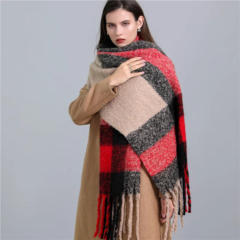 Women's luxurious winter fashion accessory: a soft checked scarf with warm, chic tassels.