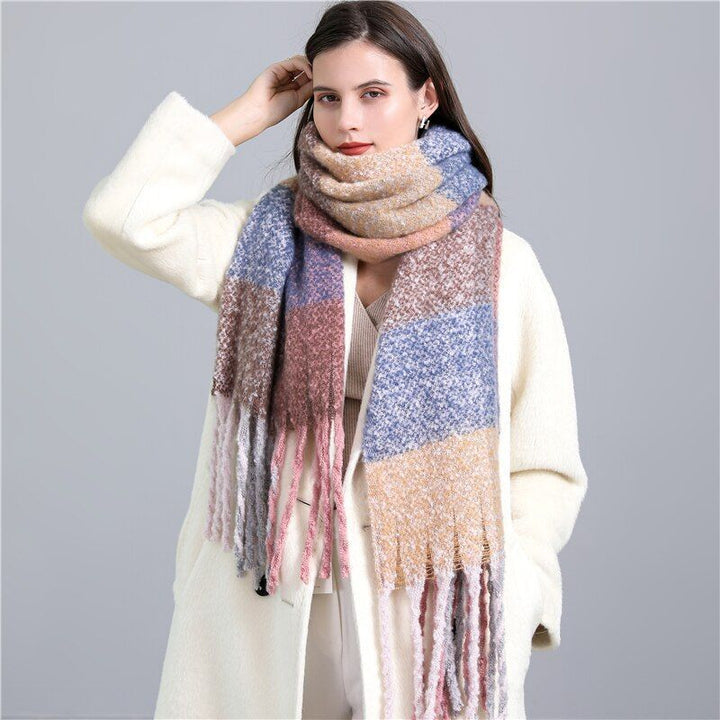 Elegant women's soft checked winter scarf, a luxurious and warm accessory for sophisticated winter outfits.