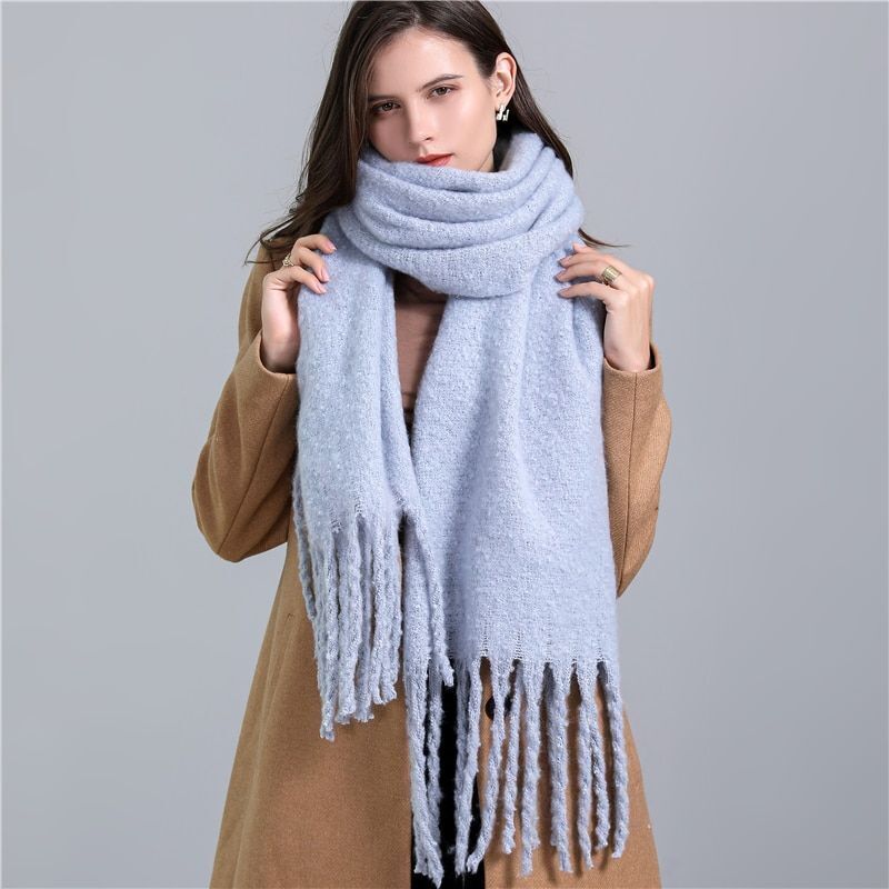 Soft checked winter scarf for women, offering luxurious warmth & a stylish look for cold days.