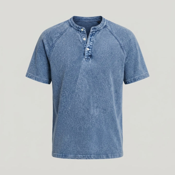 Soft washed fabric close-up of a grey men's Henley t-shirt, comfortable texture for casual wear.