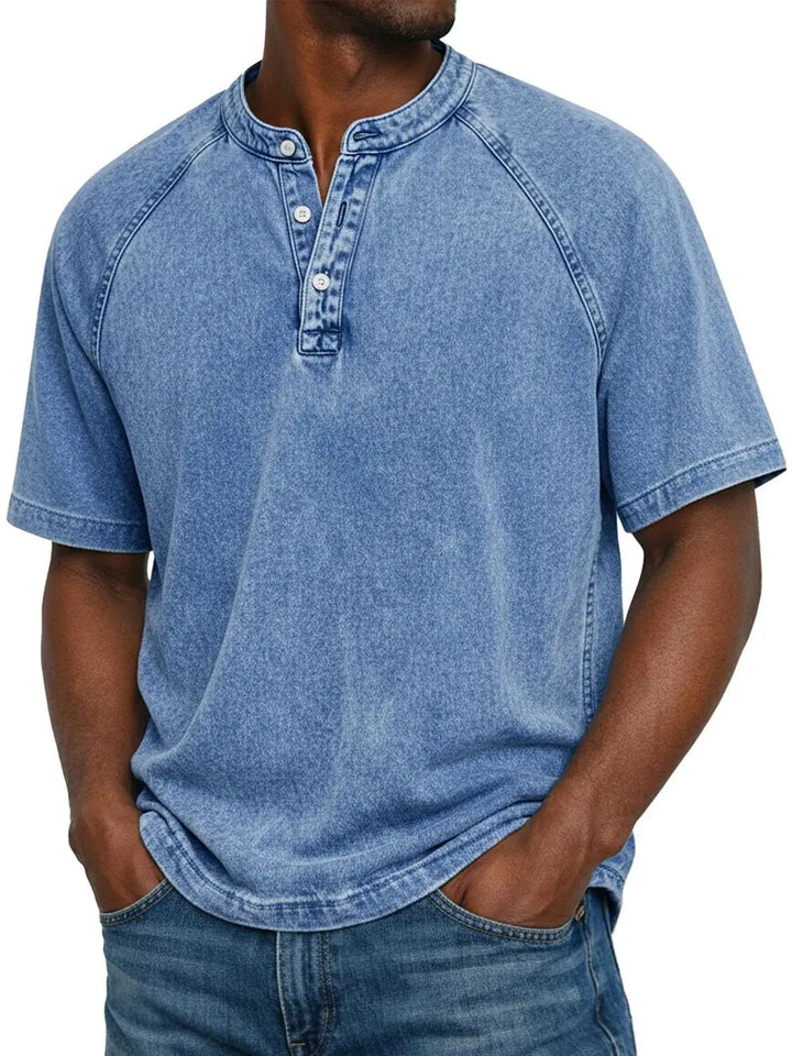 Detail of the button placket on a men's washed Henley t-shirt, enhancing its casual everyday look.
