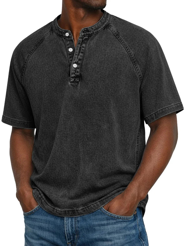 Neatly folded men's cosy washed Henley t-shirt, a short sleeve casual wardrobe staple.