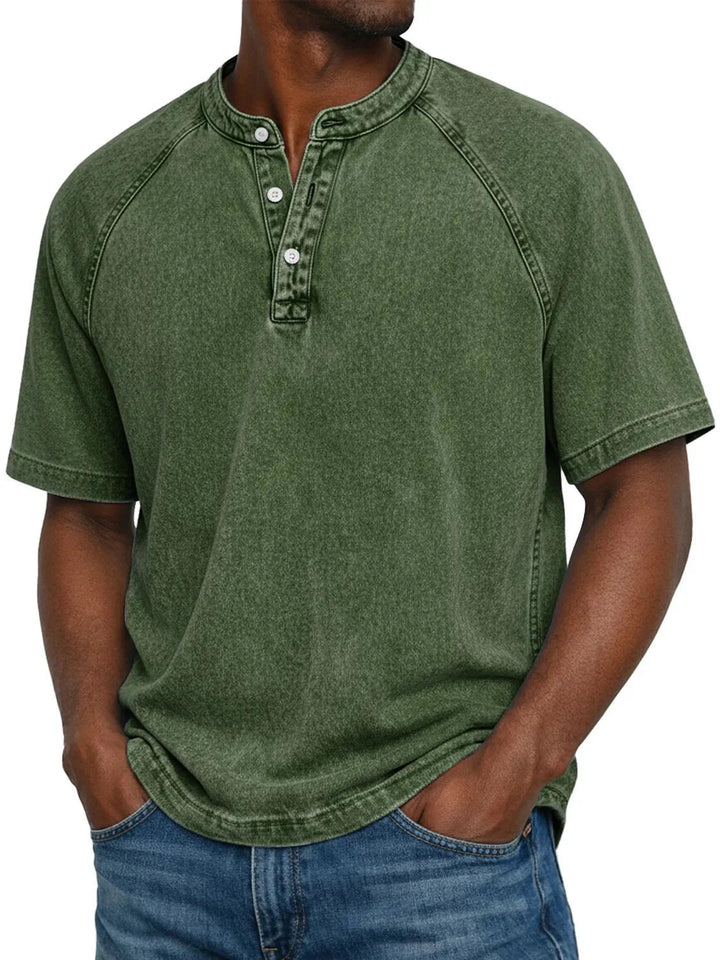 Man in a casual short sleeve washed Henley t-shirt, relaxed fit, perfect for everyday comfort.