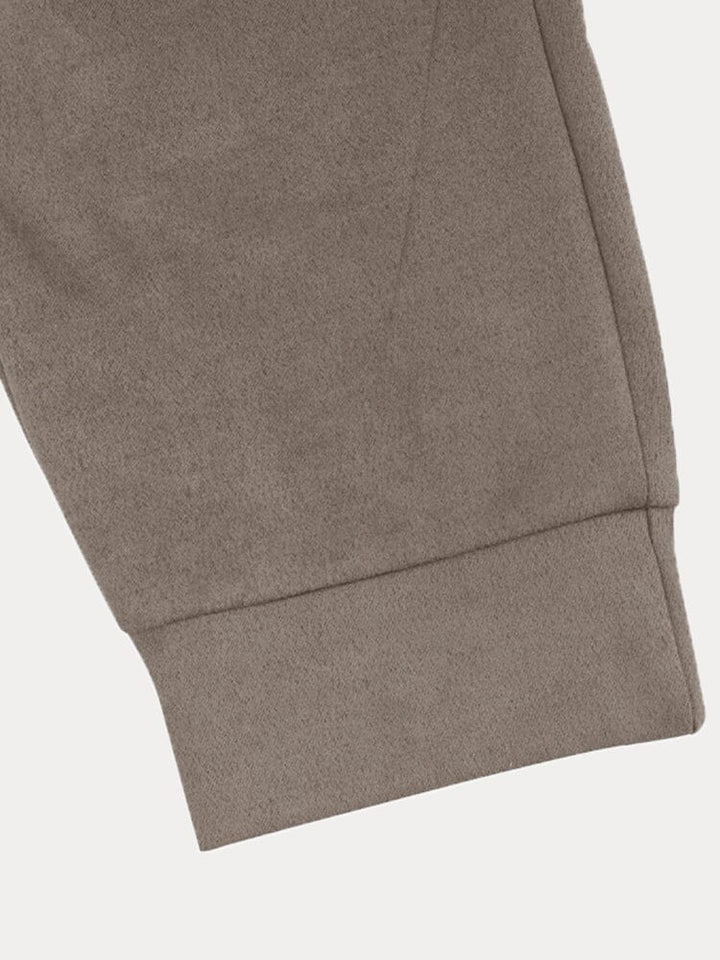 Side profile of a man in a comfortable men's stylish long sleeve jogger set, perfect for daily wear.