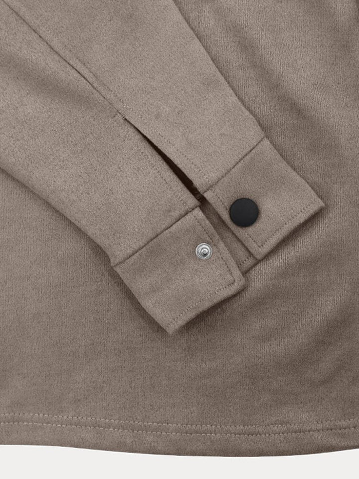 Detail of the long sleeve top from a men's stylish casual tracksuit, highlighting design & fit.