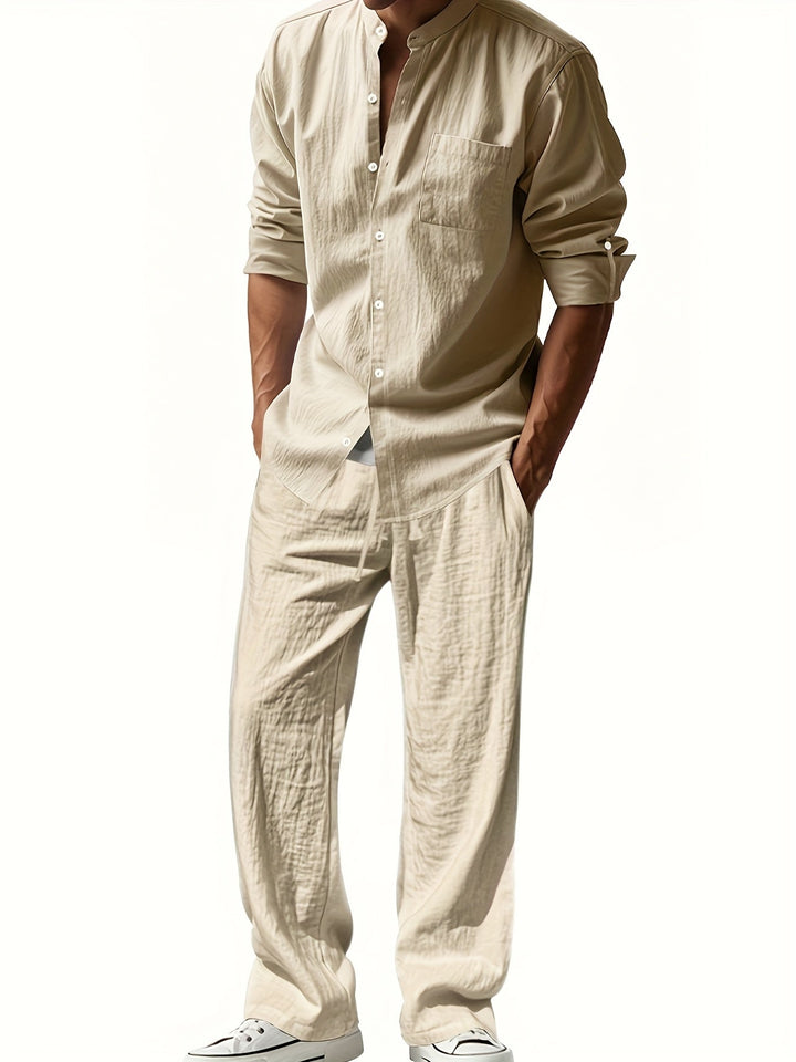 Modern men's two-piece set featuring a band collar long sleeve shirt & matching pants for casual fashion.