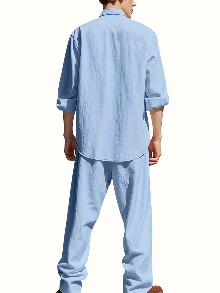 Man showcasing a relaxed fit band collar shirt & matching pants set. Effortless style, casual summer fashion.