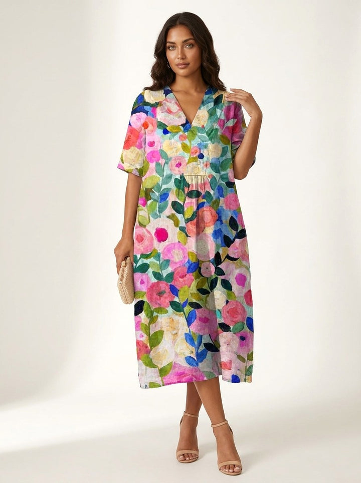 Women's V-neck midi dress with vibrant nature-inspired floral print, perfect for summer casual wear.