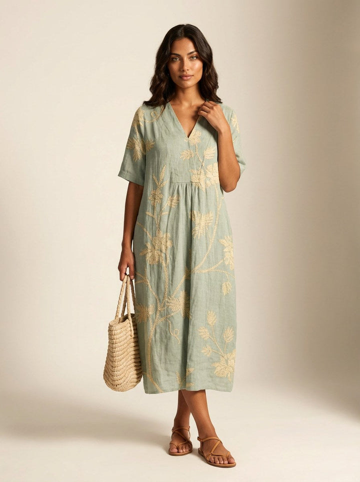 Relaxed fit women's v-neck midi dress in a stunning floral print, ideal for casual summer days.