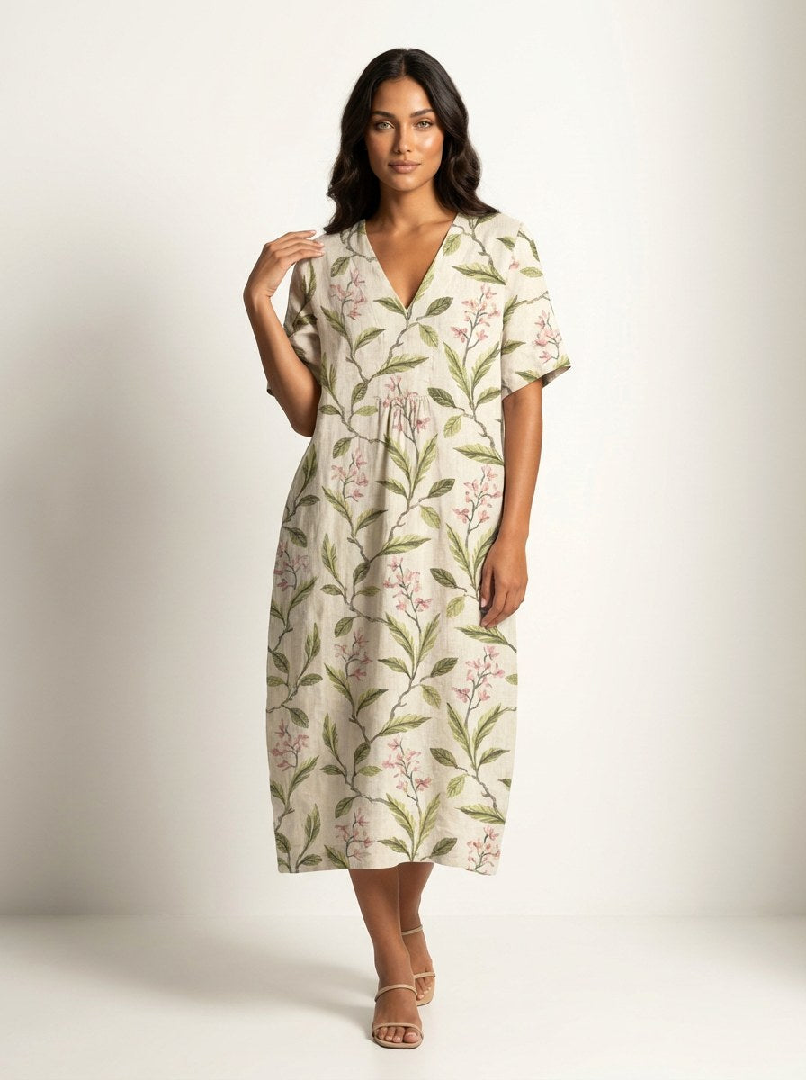 Chic summer v-neck midi dress for women, with an all-over nature print and flowy, relaxed design.