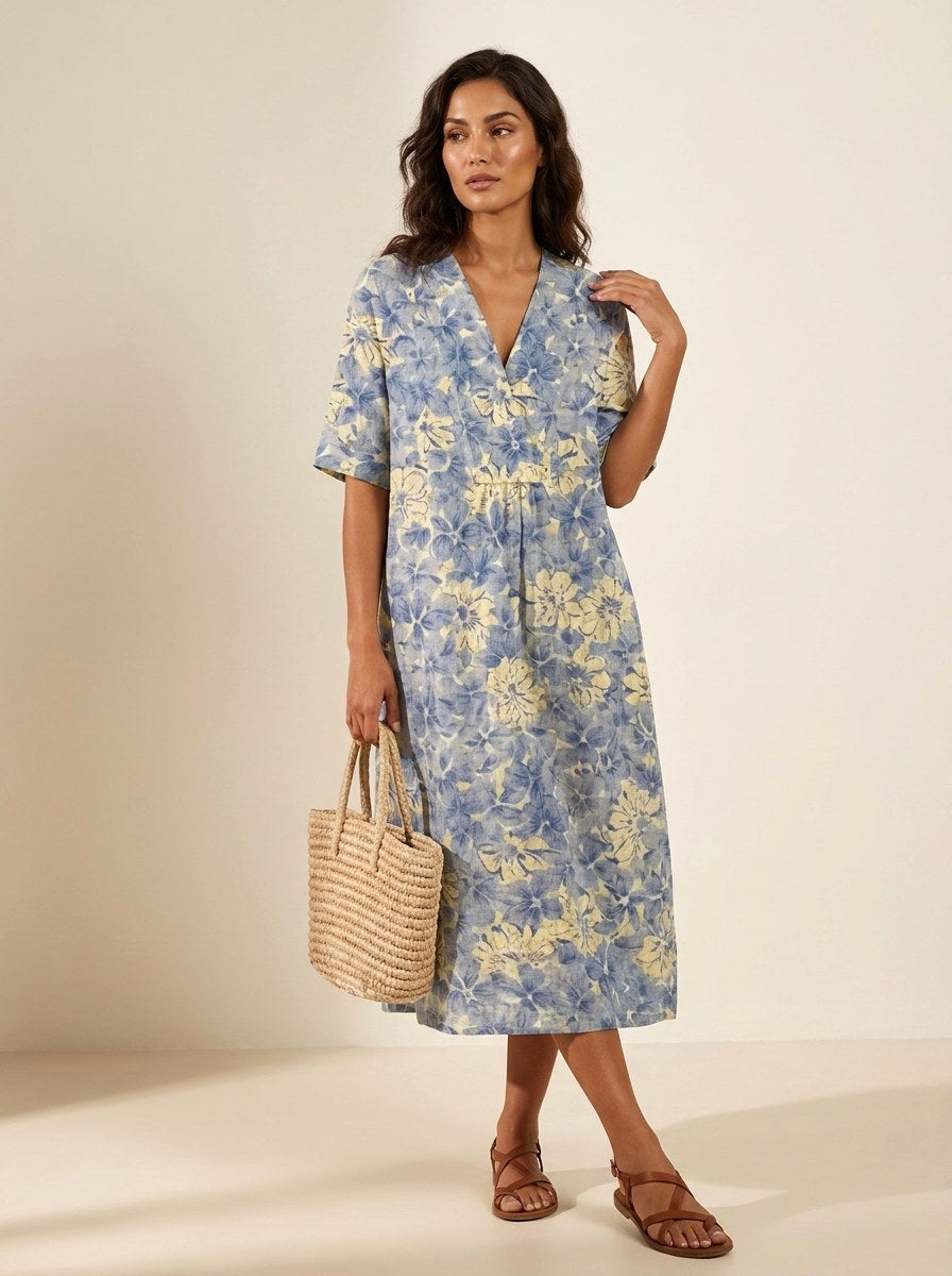 Chic women's v-neck midi dress with an eye-catching floral print, suitable for casual outings and vacation.