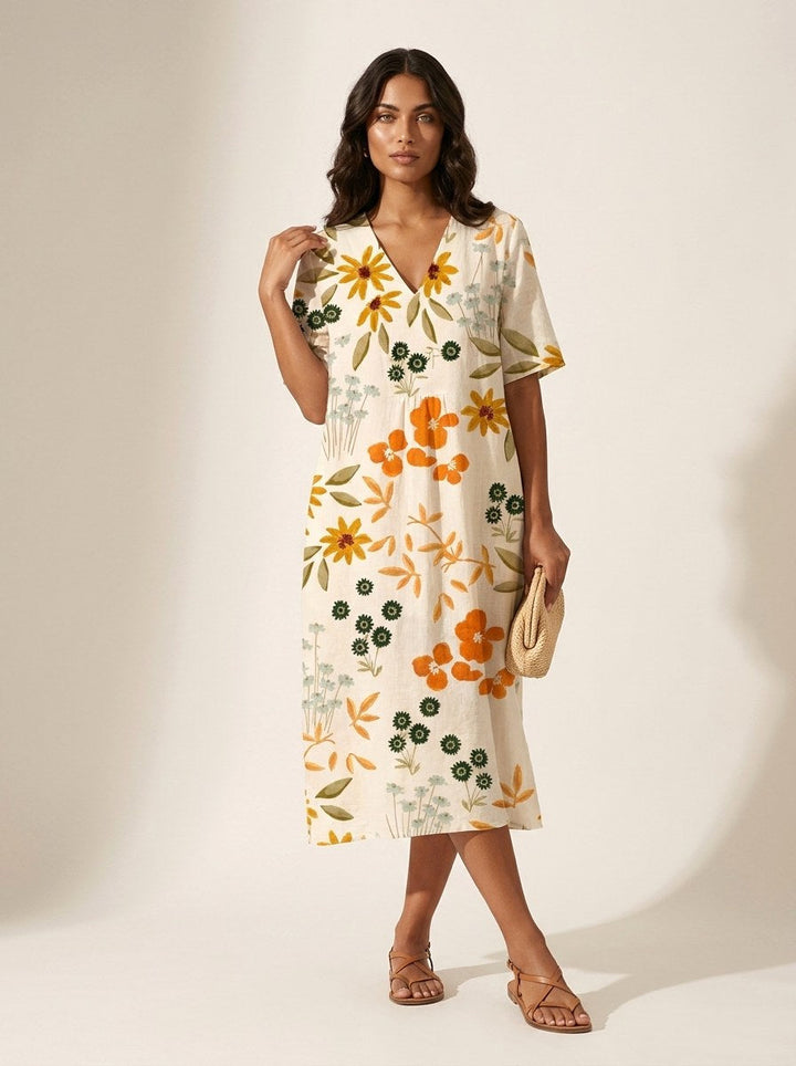 Summer-ready women's v-neck midi dress with a relaxed, flowy fit and unique nature-inspired print.