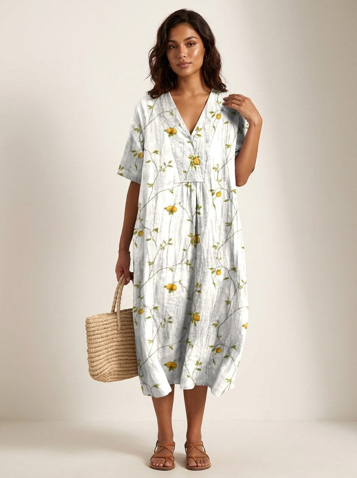Women's v-neck midi dress with a beautiful nature print, offering a comfortable and stylish relaxed fit.