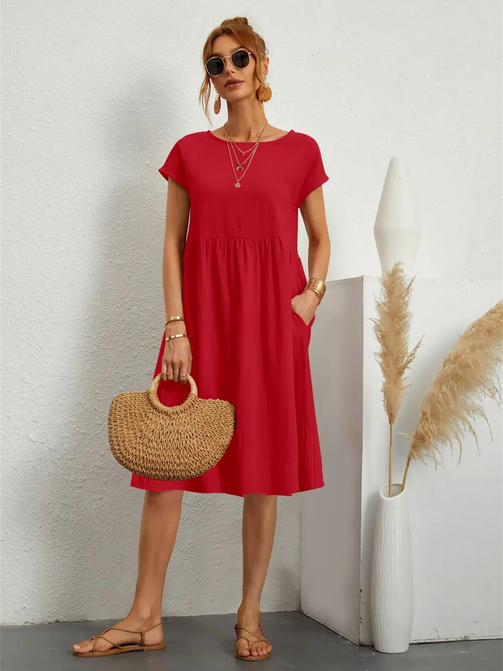 Women's effortless A-line midi dress with pockets, perfect for casual everyday wear.