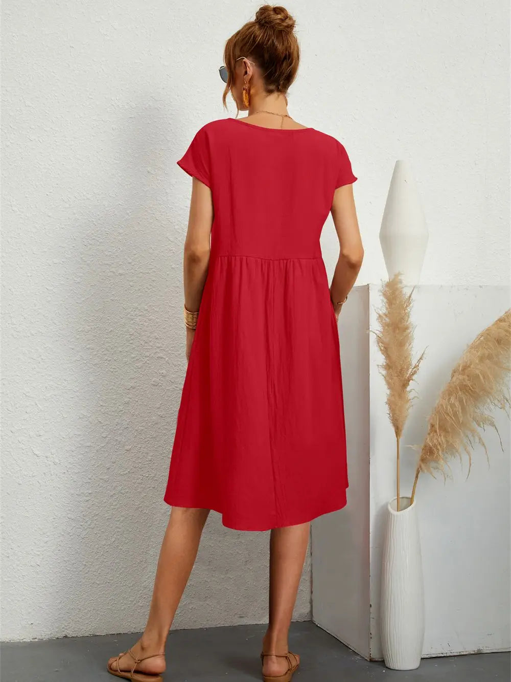 Chic women's A-line midi dress, perfect for casual outings, includes practical pockets.