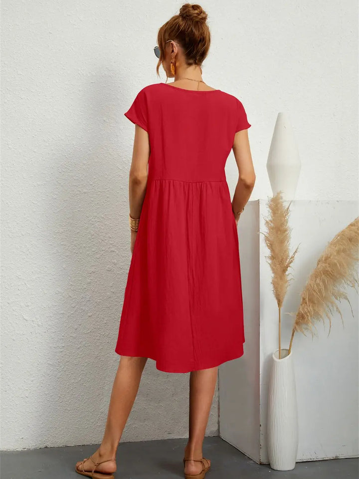 Chic women's A-line midi dress, perfect for casual outings, includes practical pockets.