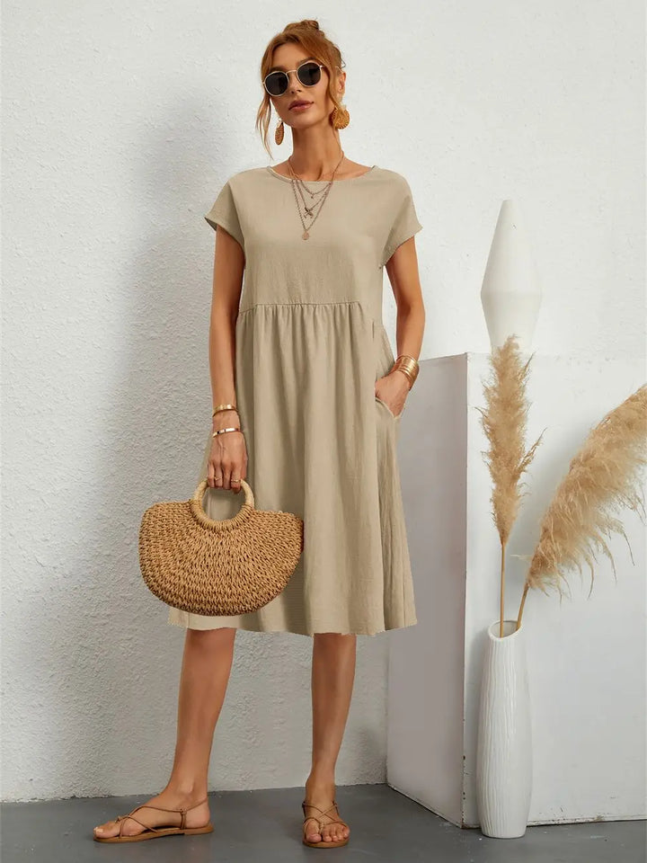 Everyday women's A-line midi dress with short sleeves and discrete side pockets for convenience.