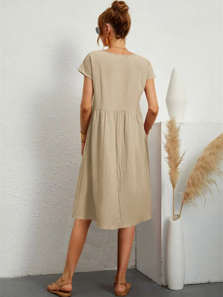 Flowy A-line midi dress for women, offering effortless style, comfort, and essential pockets.