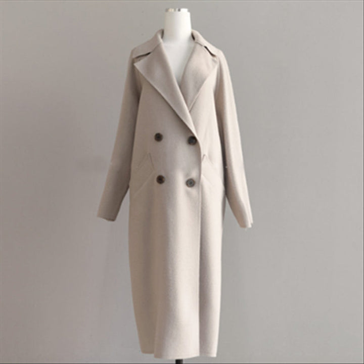 Stylish women's long wool coat. Elegant casual outerwear, warm ladies jacket for winter and fall fashion.