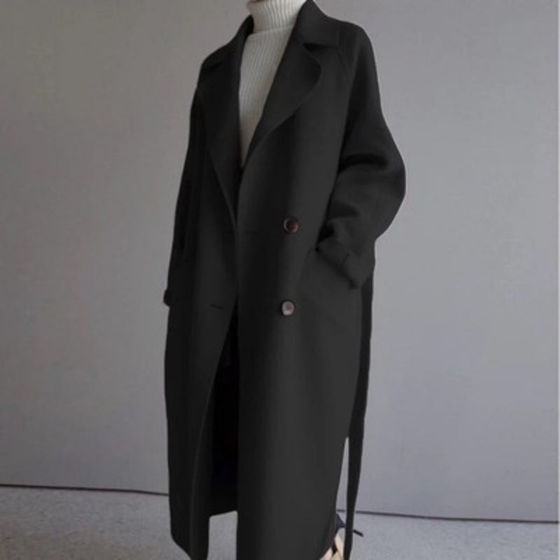 Elegant long wool winter jacket for women. Classic style casual outerwear, a warm and stylish ladies coat.
