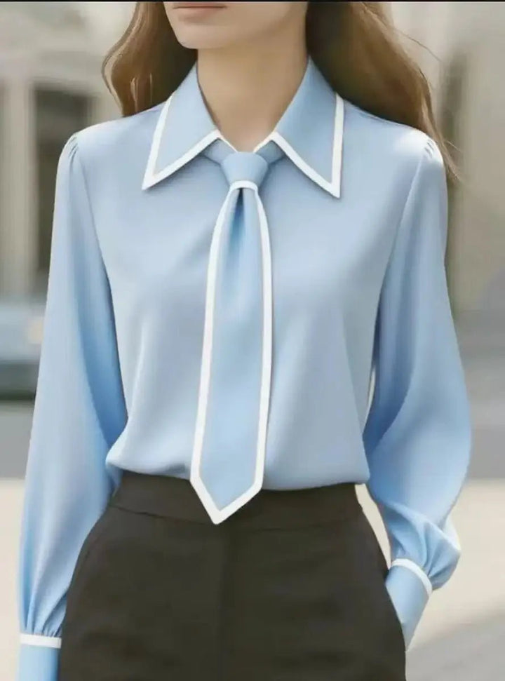 Refined women's fashion blouse with a stylish contrast tie neckline and long sleeves. Ideal elegant top for work.