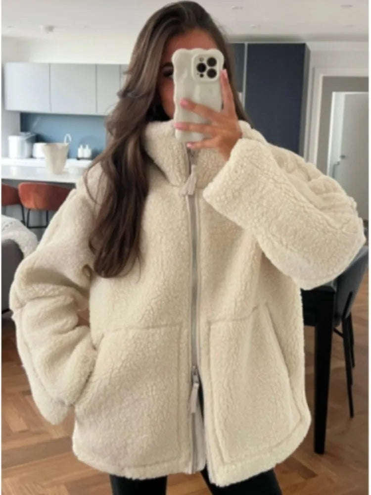 Plush women's cozy teddy jacket, incredibly warm for winter. Soft outerwear providing ultimate comfort and style.