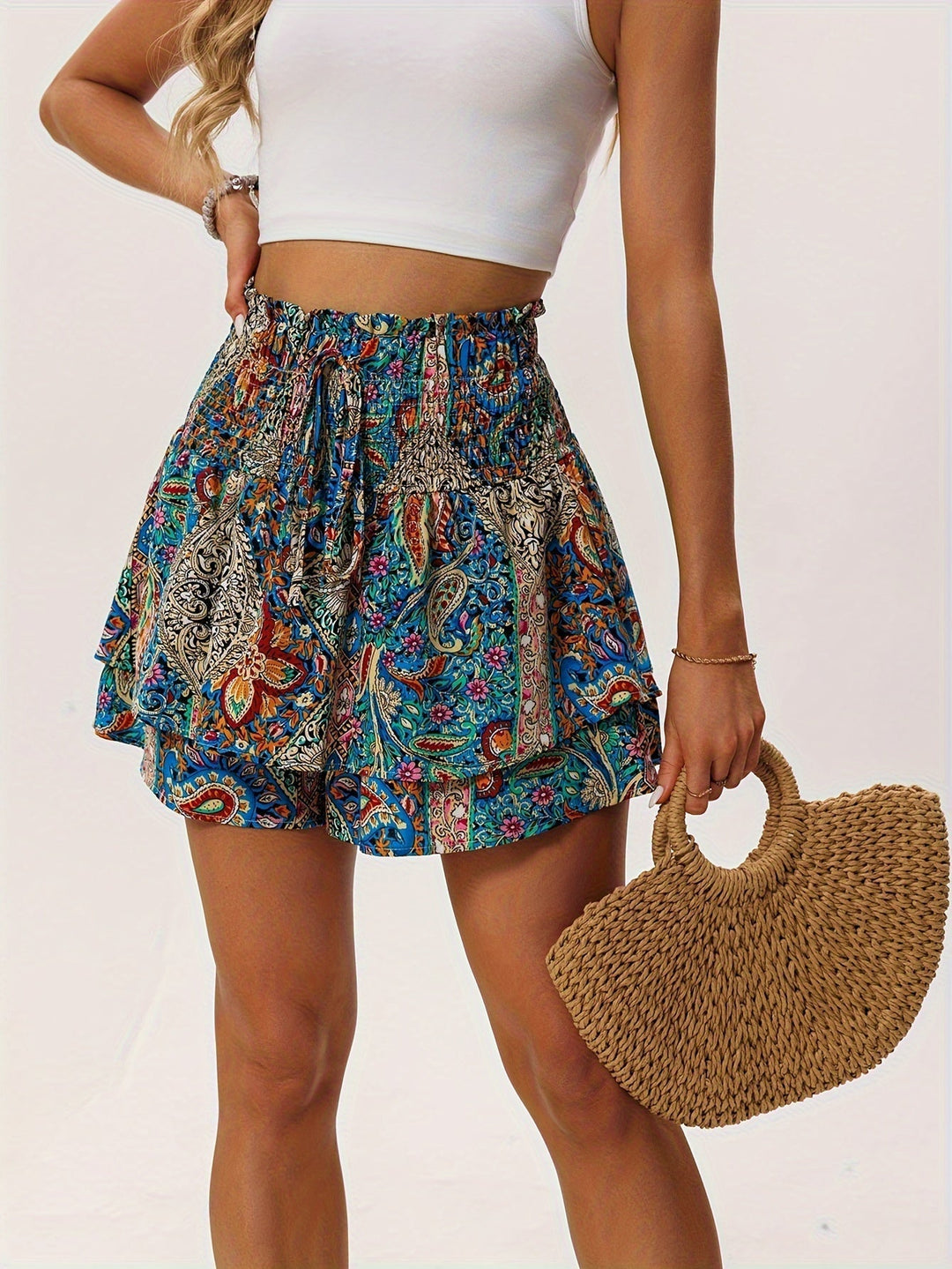 Trendy women's patterned shorts with a feminine floral design, comfortable drawstring waist, and ruffled hem.