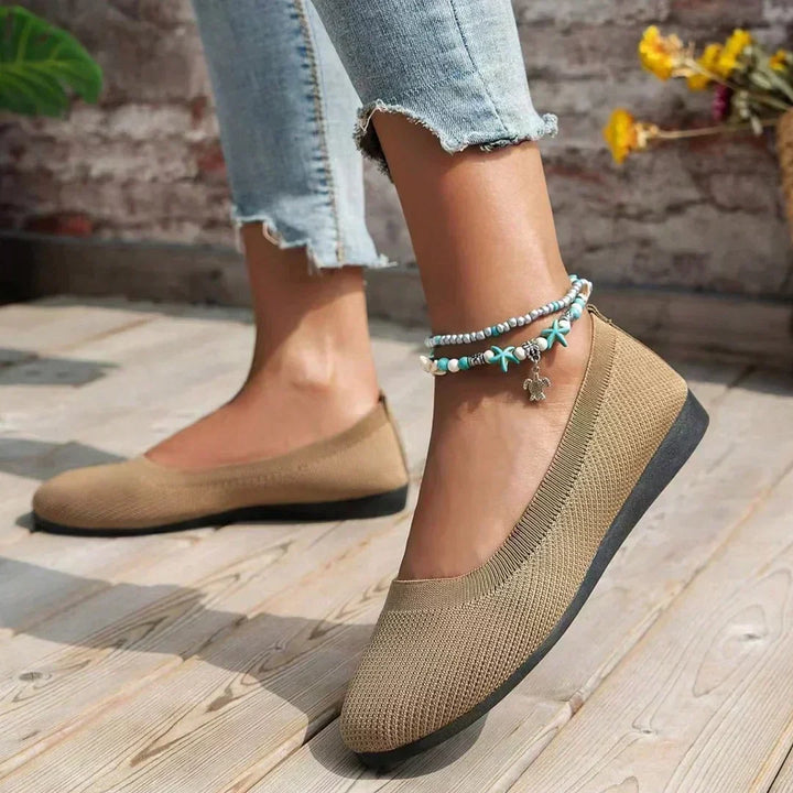 Light grey women's orthopedic slip-on sneakers for walking, breathable fabric & wide fit.