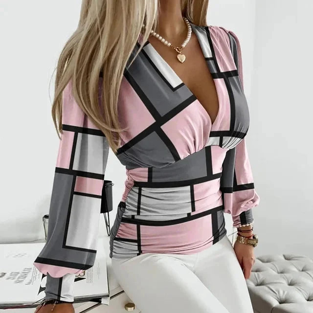 Sophisticated women's V-neck blouse with long sleeves and a defined waist, suitable for elegant fashion.