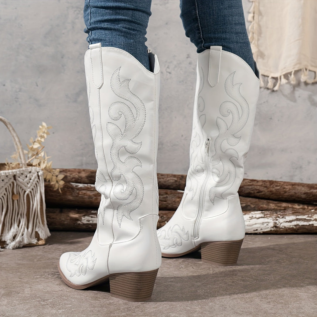 Women's knee high western boots with intricate embroidery, perfect for a stylish country look.