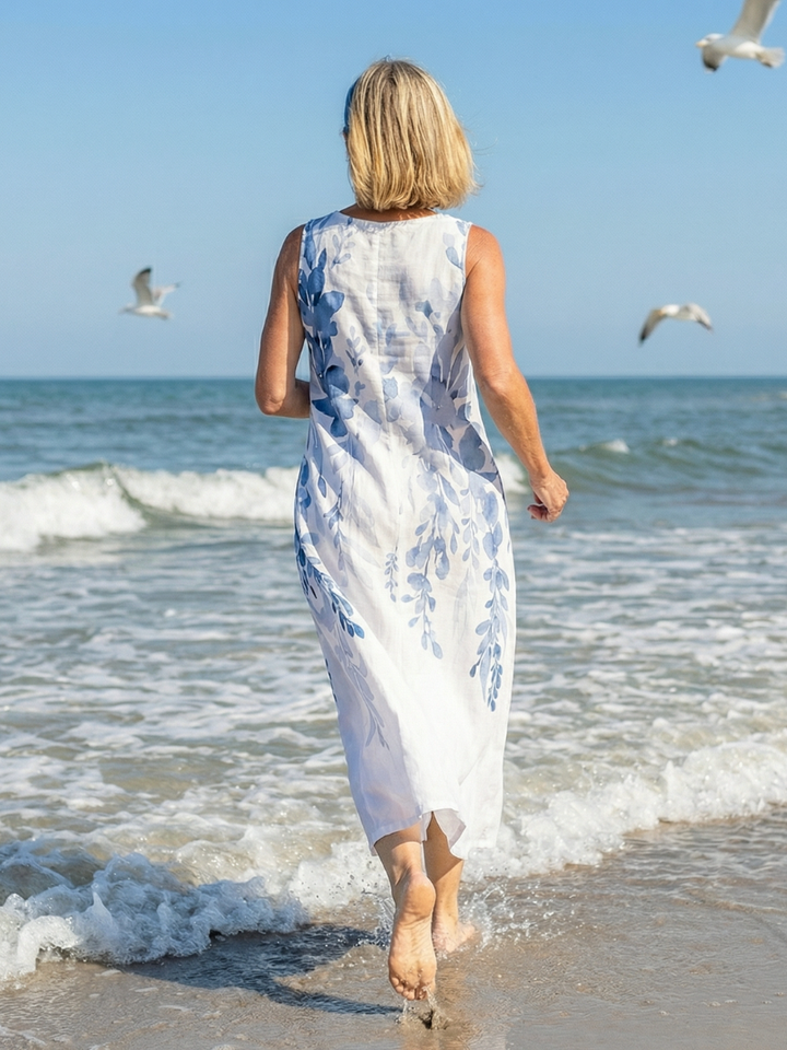 Chic women's sleeveless floral maxi dress with a beautiful botanical print, great for summer fashion & vacations.