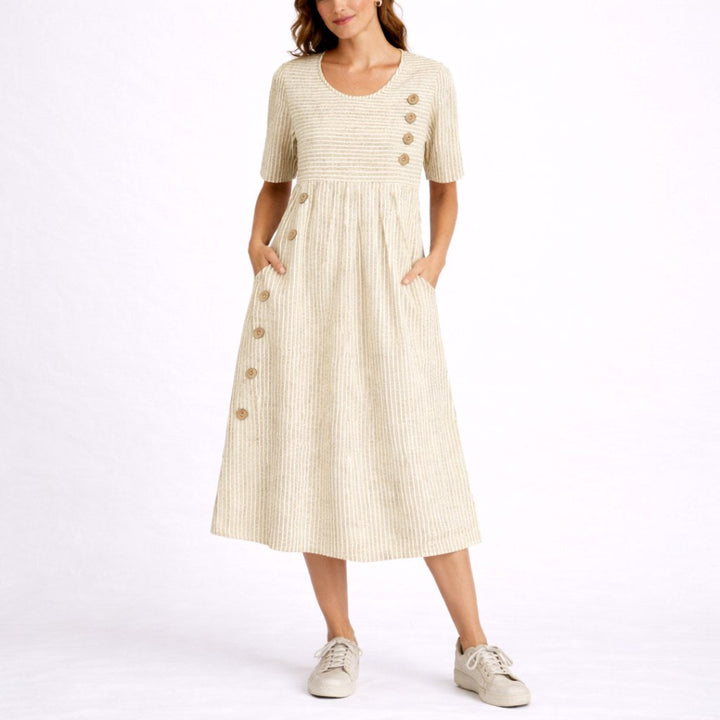 Stylish women's striped midi dress with a relaxed, lightweight fit, ideal for casual summer fashion.