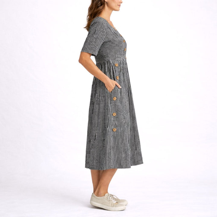 Fashionable women's striped midi dress, a relaxed and lightweight choice for casual summer comfort.