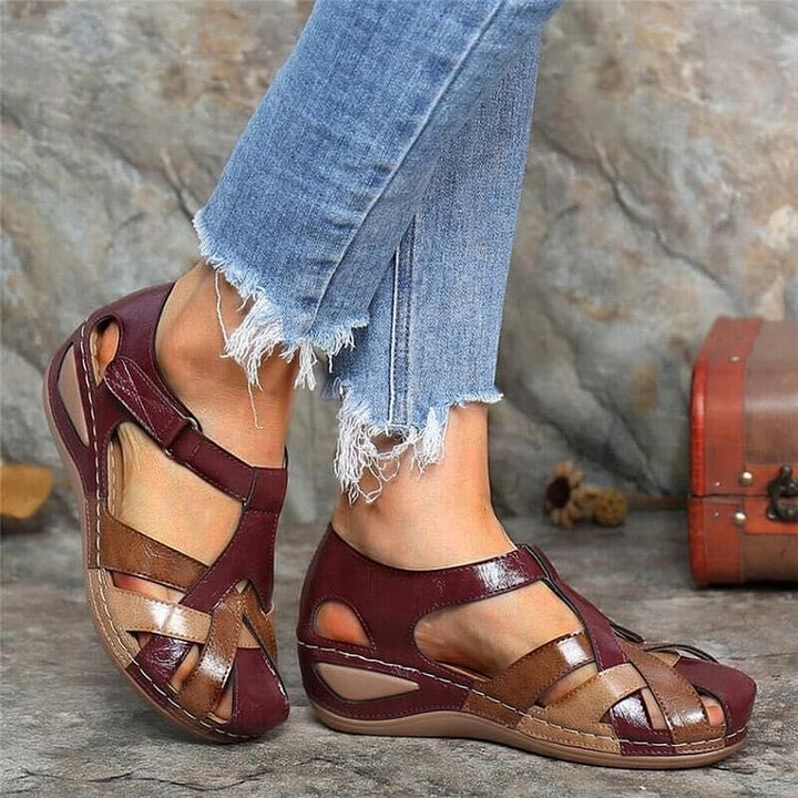 Red woven T-strap platform sandals for women, featuring a comfortable wedge heel and peep toe design.