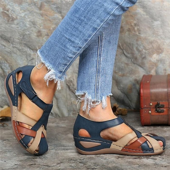 Elegant T-strap platform sandals for women with intricate woven design, stable wedge heel, and adjustable strap.