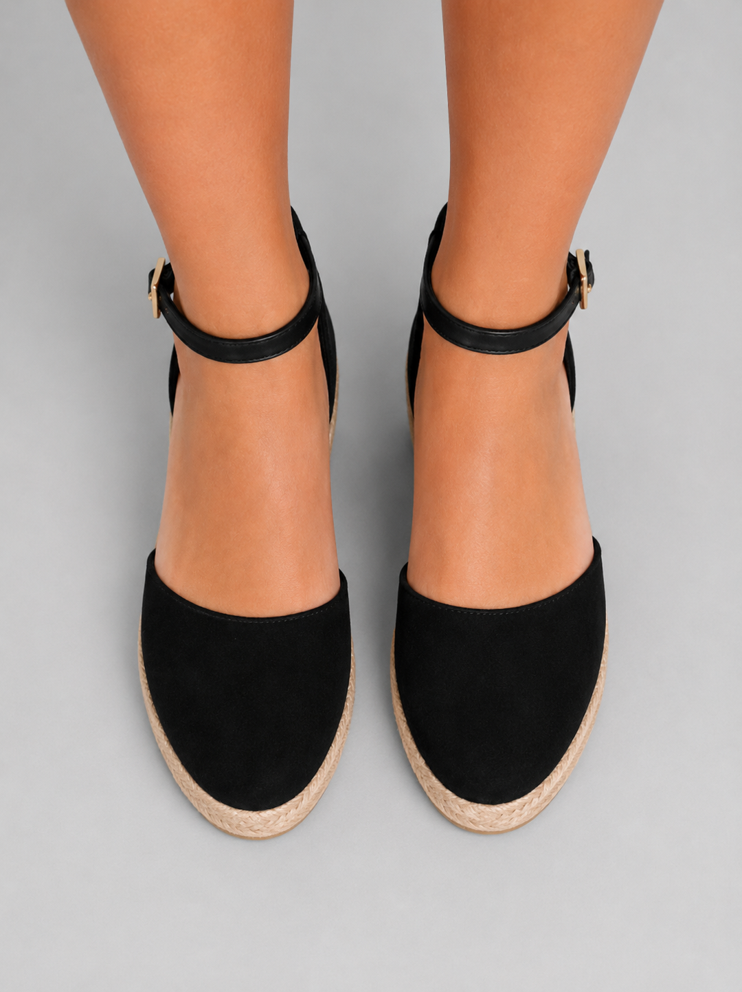 Front view of women's espadrille wedge sandals, highlighting the open-toe design and ankle strap.