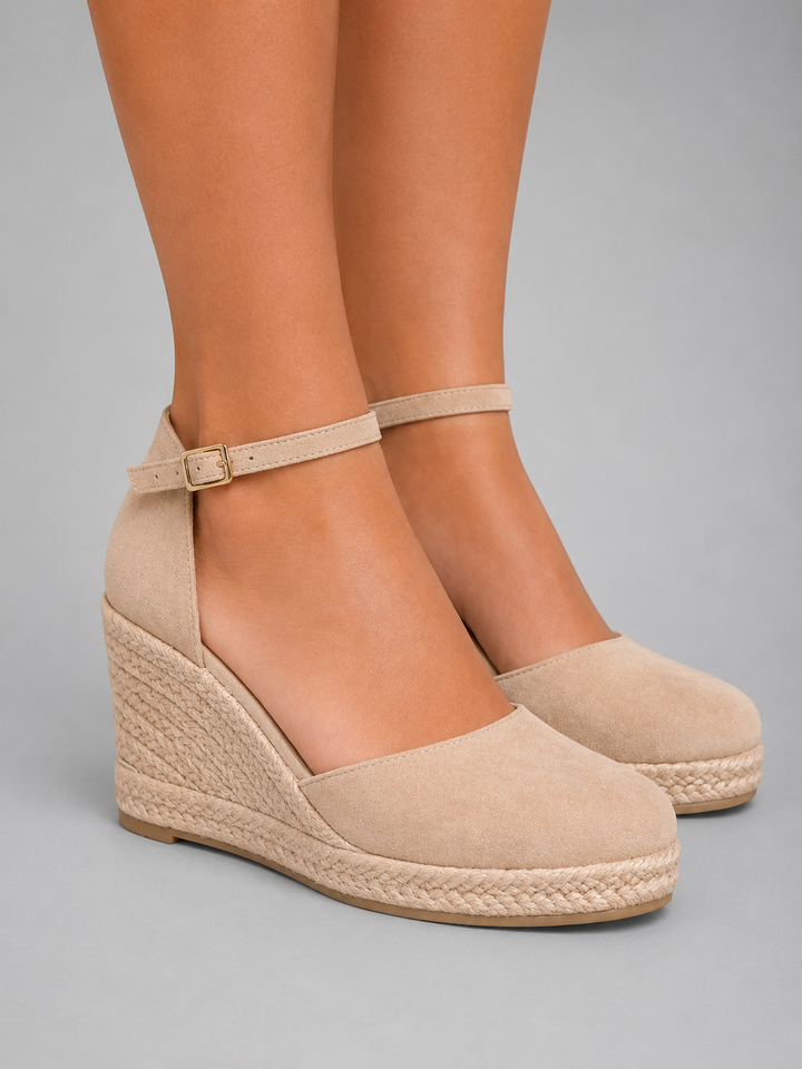 Versatile women's espadrille wedge sandals, a comfortable ankle strap shoe for summer occasions.