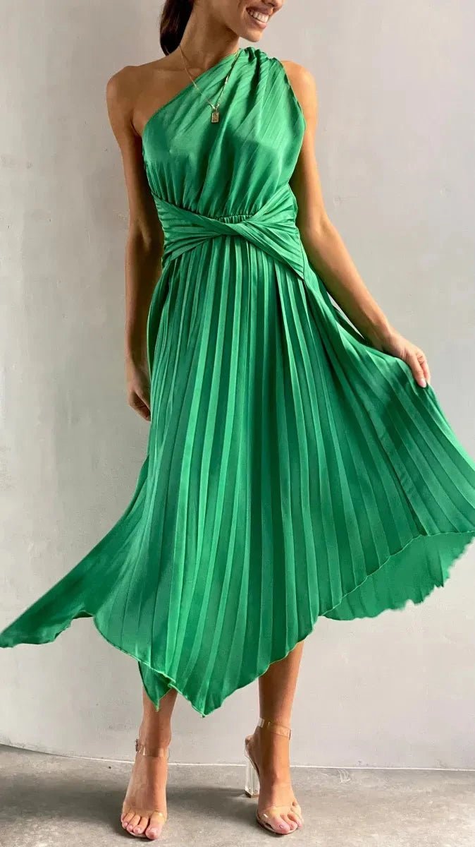 Model wearing a sophisticated one-shoulder pleated cocktail dress, perfect for formal occasions.