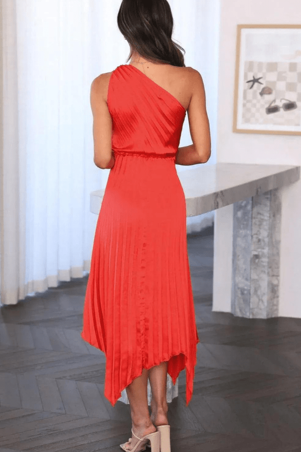 Detail of the one-shoulder neckline and delicate pleats on this elegant midi cocktail dress.