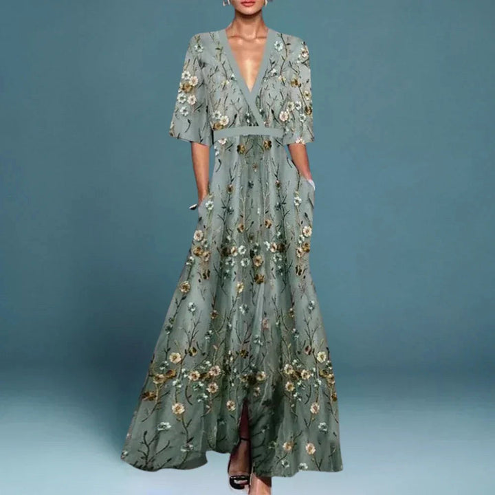Women's blue floral maxi dress with a flowy V-neck, perfect for elegant summer occasionwear or a holiday.