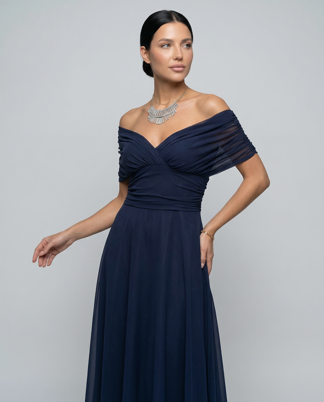 Elegant women's off-shoulder maxi dress with ruched details for race day.