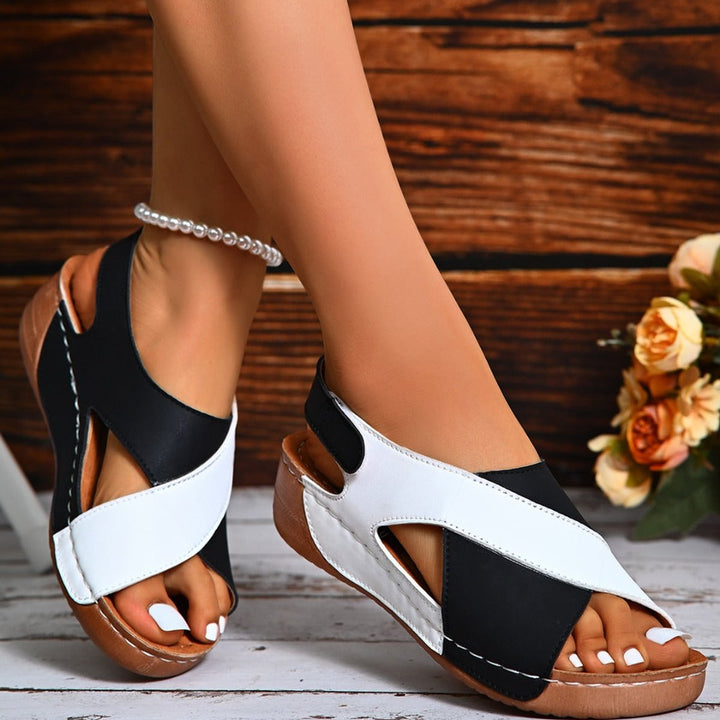 Cozy women's orthopedic slingback wedge sandals with arch support & adjustable strap for comfort.
