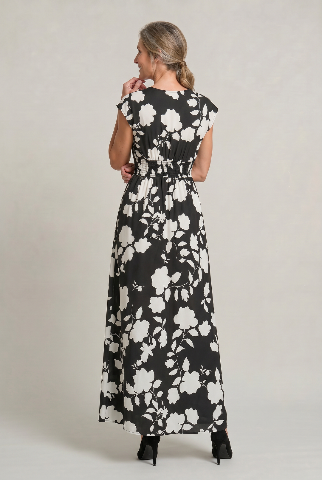 Stylish women's A-line maxi dress in a vibrant floral print. Features a flattering V-neck, perfect for race day attire.