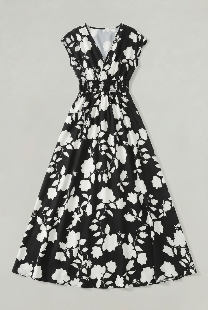 Women's elegant floral V-neck maxi dress, featuring a comfortable smocked waist and flowing A-line skirt for summer.