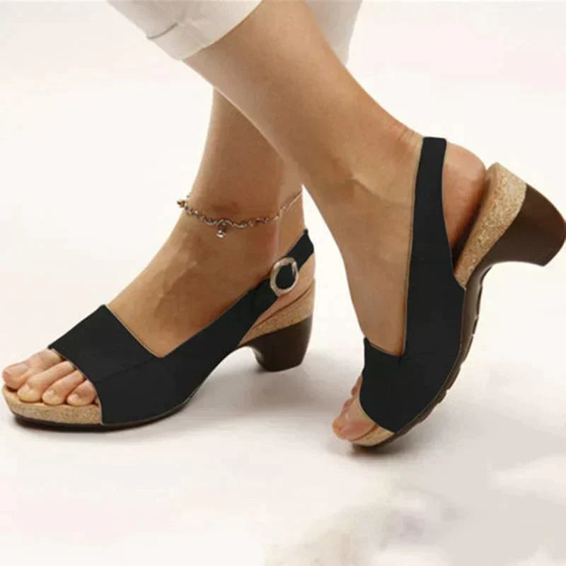 Elegant women's platform sandals with slingback and wedge heel for casual summer fashion.